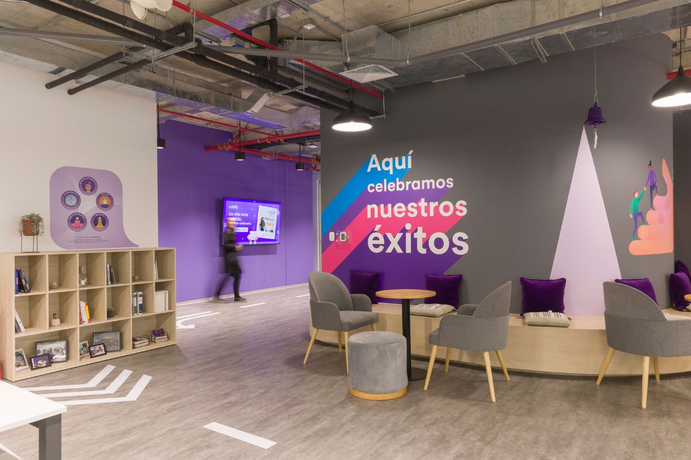 Cabify Offices - Social hub with purple branding and 'celebrating success' wall graphic - Contract Workplaces.jpg